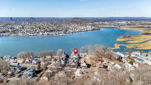 birds eye view of property with a residential view and a water view