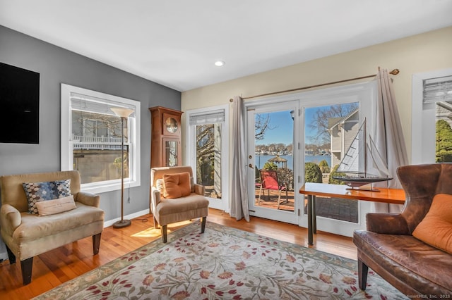 sitting room with light wood-style floors and baseboards