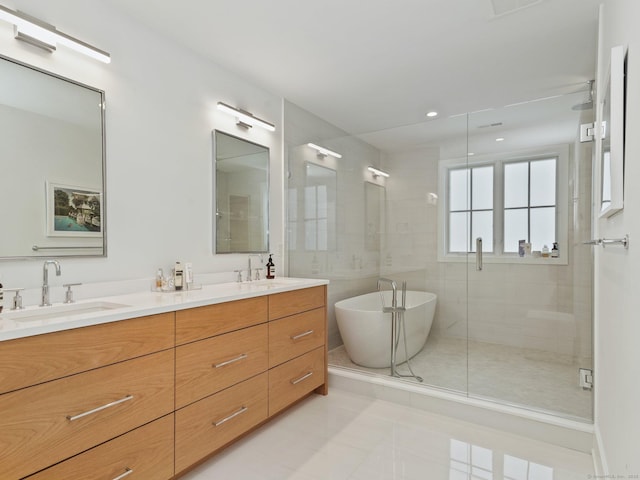 full bathroom with a stall shower, a soaking tub, a sink, and double vanity