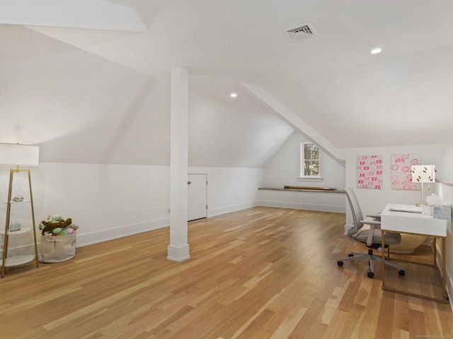 office area featuring baseboards, visible vents, wood finished floors, vaulted ceiling, and recessed lighting