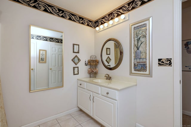 hallway with light tile patterned floors, a sink, and baseboards