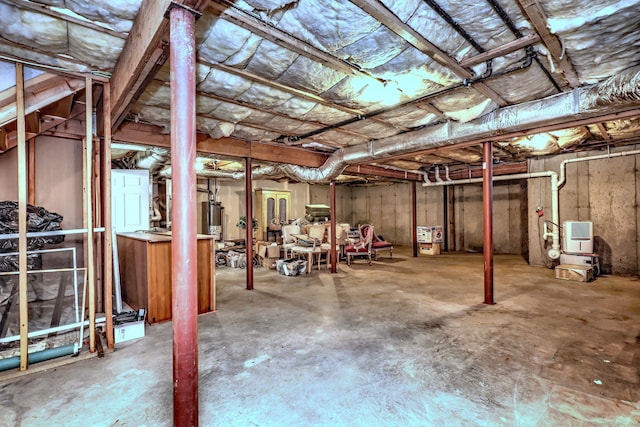 unfinished basement with gas water heater