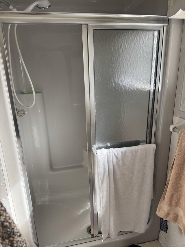 bathroom with a shower stall