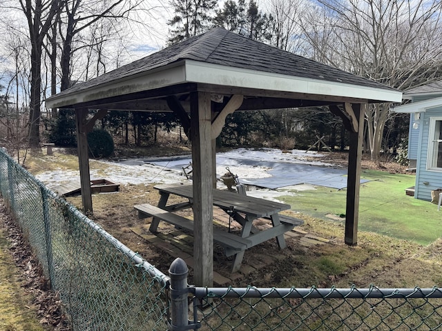 view of home's community featuring a gazebo, a lawn, and fence