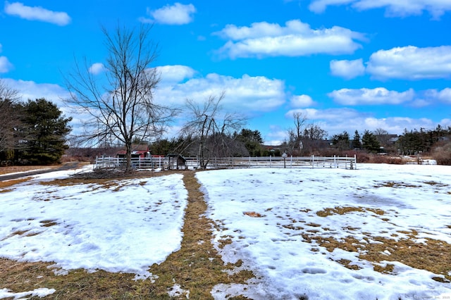 yard covered in snow with fence