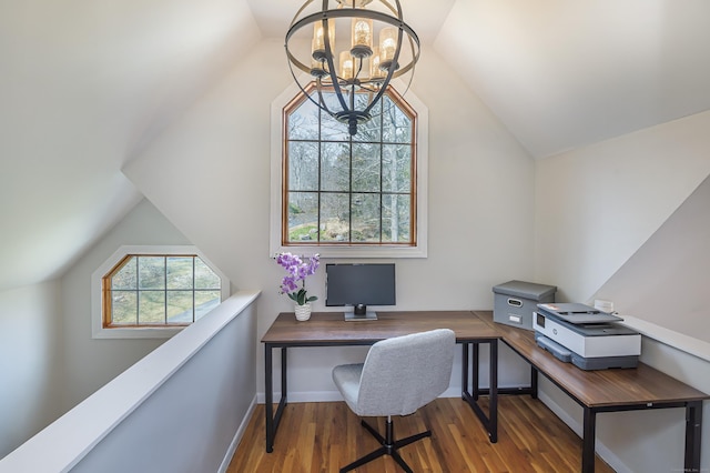 office space featuring a notable chandelier, baseboards, vaulted ceiling, and wood finished floors