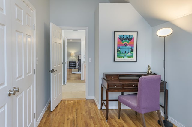 office featuring light wood-style floors and baseboards