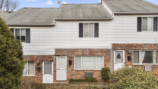 463 Cove Rd Unit 8, Stamford, CT 06902 - view of property with brick siding and a shingled roof