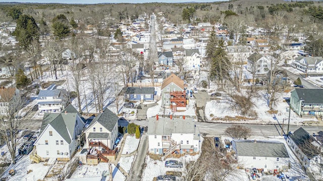 snowy aerial view featuring a residential view