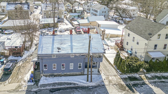 snowy aerial view with a residential view