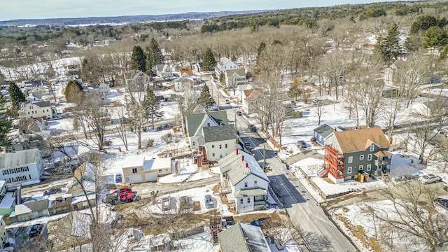 snowy aerial view featuring a residential view