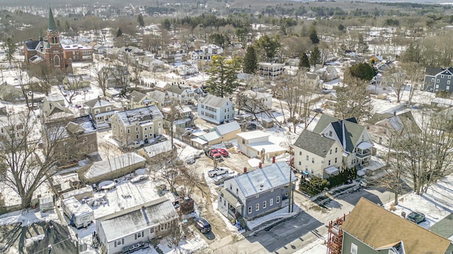 snowy aerial view featuring a residential view