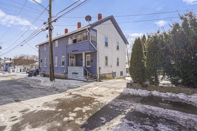 view of front of house with a chimney