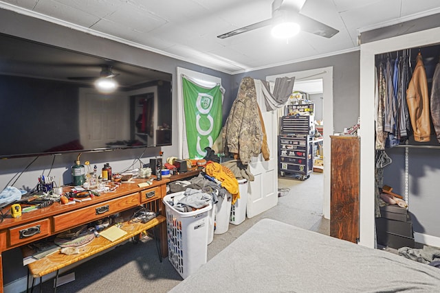 interior space featuring carpet floors, crown molding, and a ceiling fan