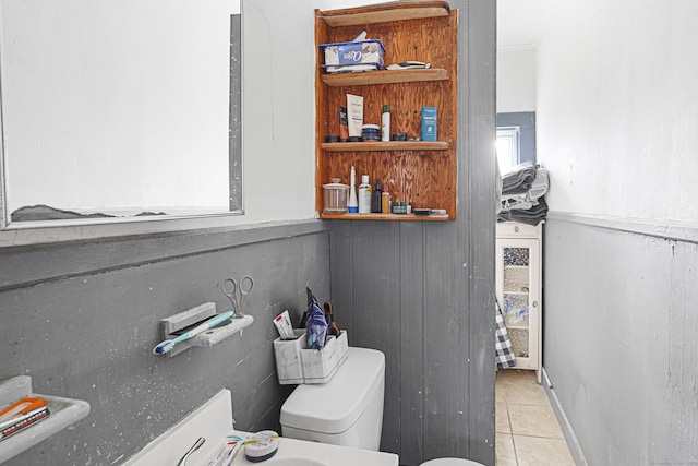 bathroom with toilet and tile patterned floors