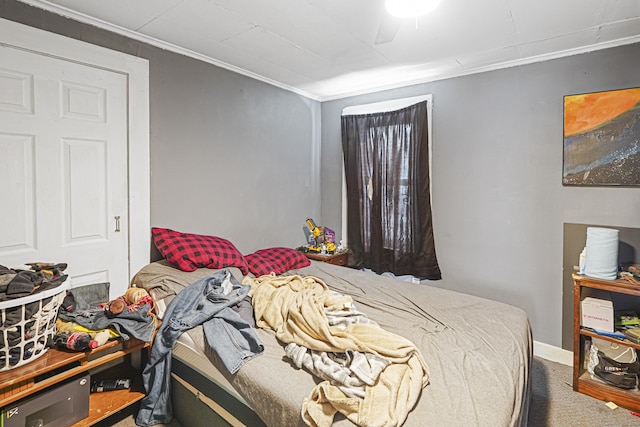 bedroom with carpet and crown molding