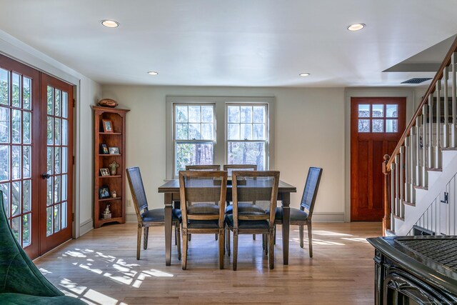 dining room with recessed lighting, french doors, and stairway