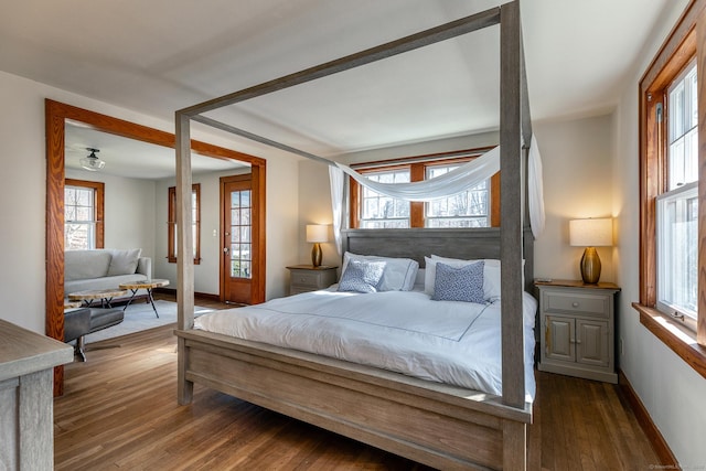 bedroom featuring wood-type flooring and baseboards