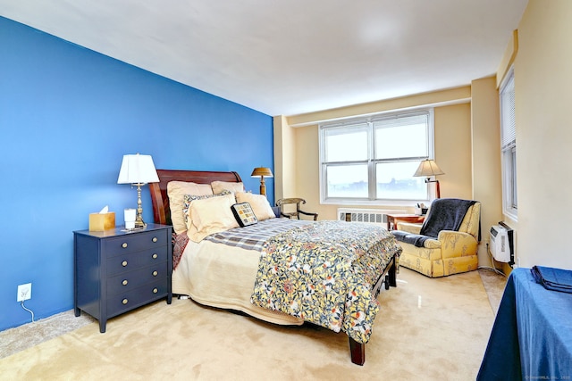 bedroom with light carpet and a wall mounted air conditioner