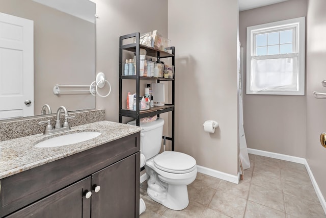 full bathroom with toilet, tile patterned floors, baseboards, and vanity