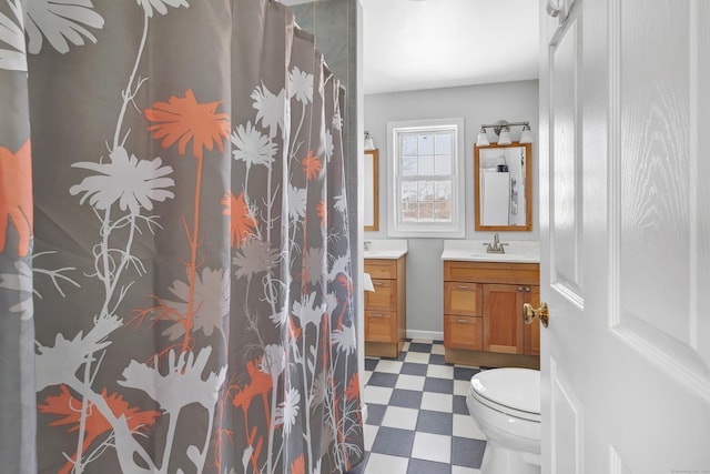 full bath with toilet, curtained shower, vanity, and tile patterned floors