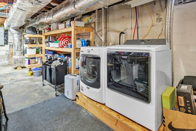 clothes washing area with laundry area and washing machine and clothes dryer