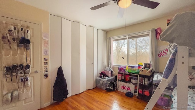 bedroom featuring light wood finished floors and a ceiling fan