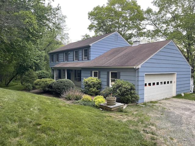 view of front of property featuring a chimney, driveway, a garage, a shingled roof, and a front yard
