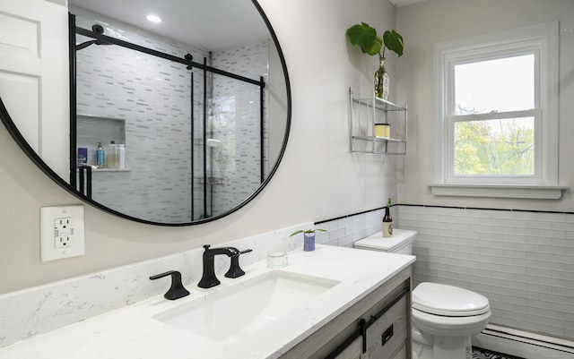 bathroom featuring tile walls, toilet, a stall shower, and a baseboard heating unit