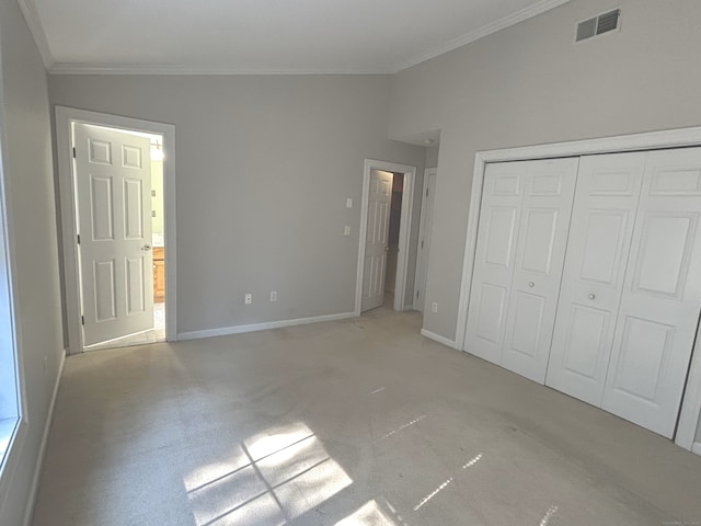 unfurnished bedroom with visible vents, baseboards, a closet, and crown molding