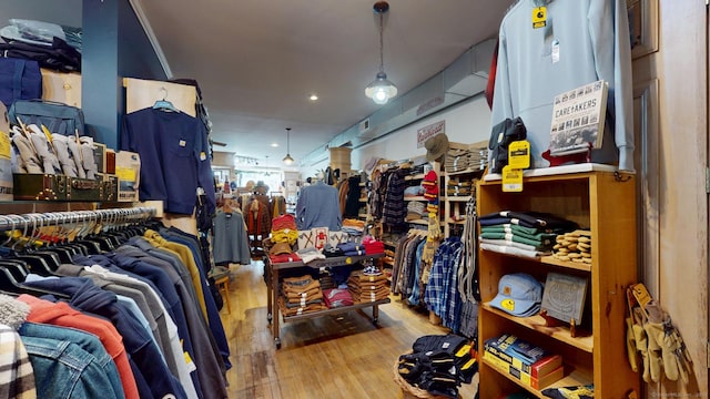 walk in closet with wood finished floors