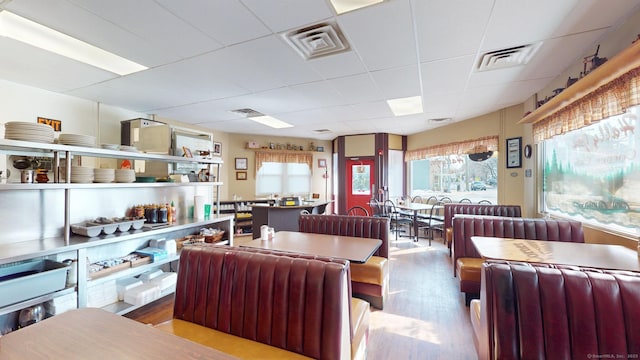 interior space with visible vents and wood finished floors