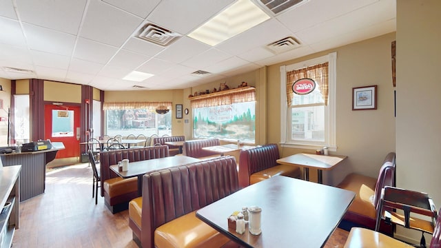 dining area featuring visible vents and a healthy amount of sunlight