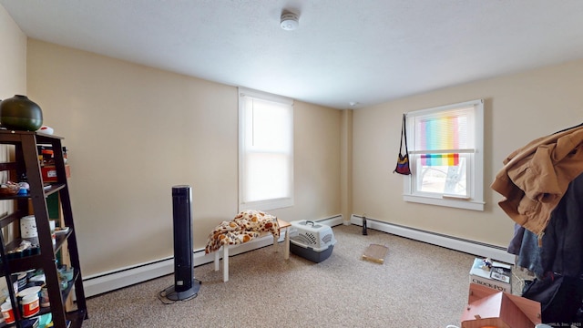 misc room with carpet and baseboard heating