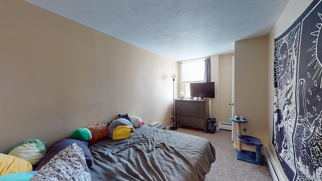 bedroom with carpet floors, a baseboard radiator, and a textured ceiling