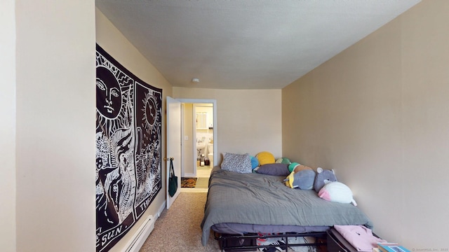 carpeted bedroom featuring baseboards