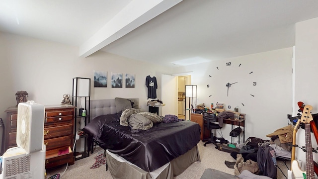 bedroom featuring light carpet and beam ceiling