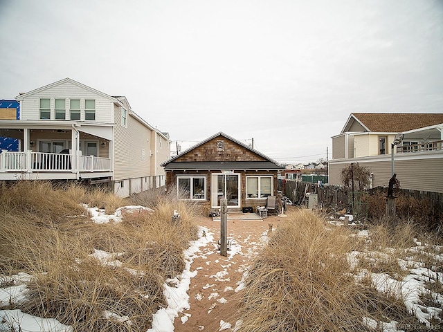 rear view of property with fence