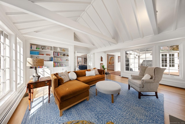 interior space featuring lofted ceiling with beams and a baseboard radiator