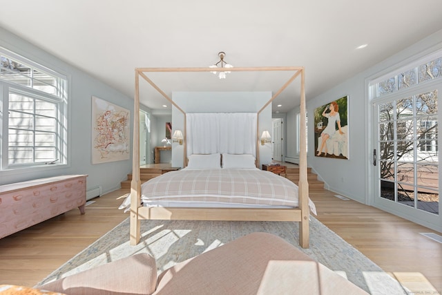 bedroom with light wood-style flooring, recessed lighting, visible vents, access to outside, and baseboard heating