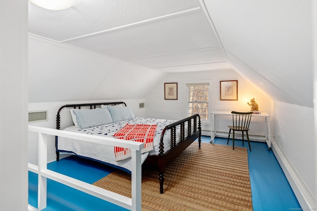 bedroom with lofted ceiling, a baseboard radiator, and visible vents