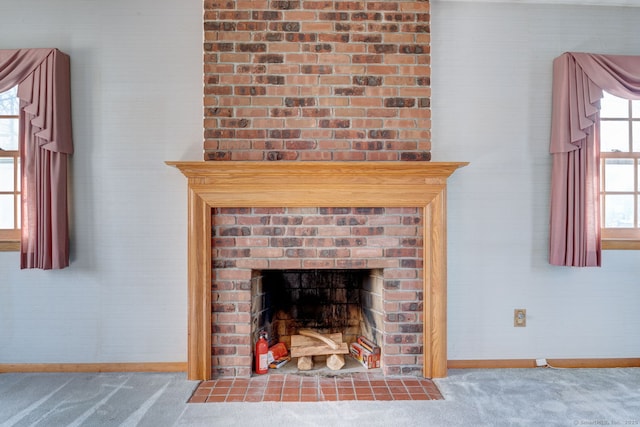 room details featuring a brick fireplace, carpet flooring, and baseboards