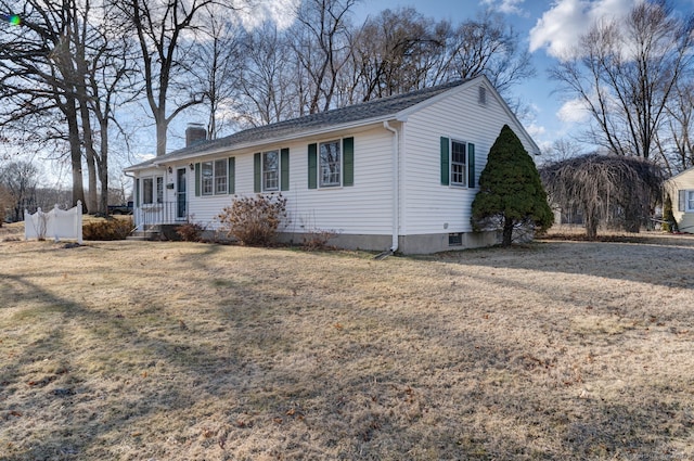 single story home featuring a front lawn and a chimney