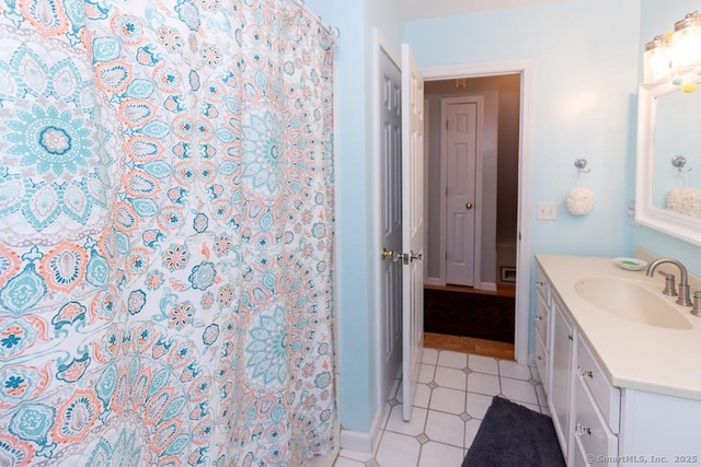 bathroom with curtained shower and vanity