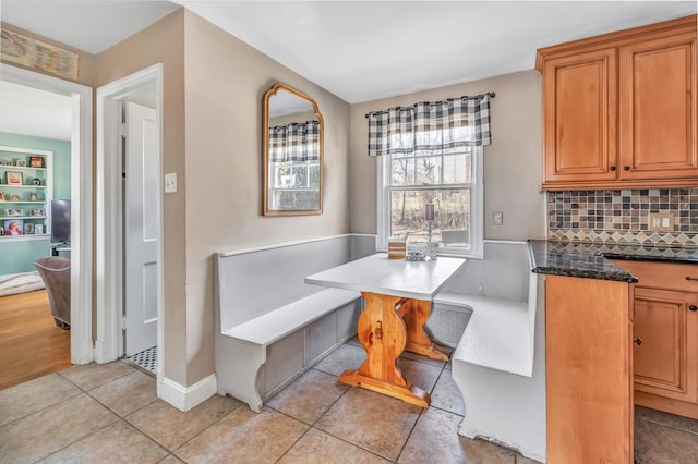 dining room with light tile patterned floors and breakfast area