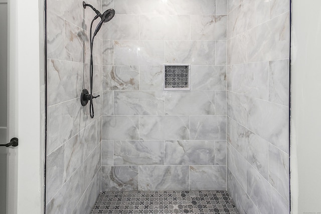 full bathroom with a tile shower