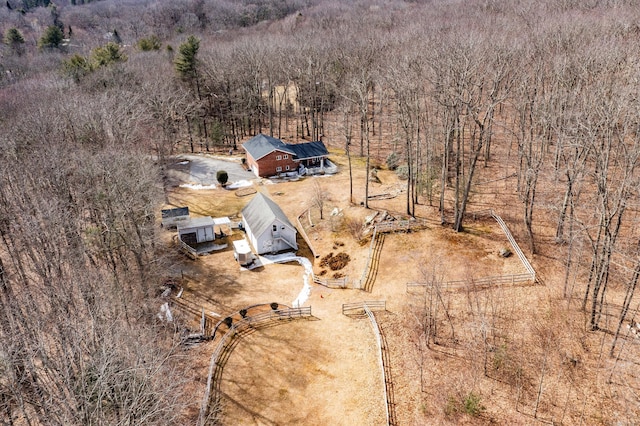 bird's eye view featuring a wooded view