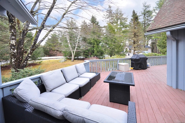 wooden deck featuring grilling area and an outdoor hangout area