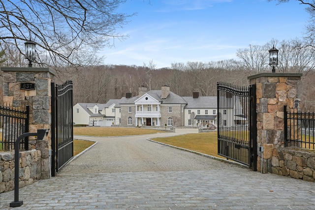 view of street featuring a gated entry, a residential view, and a gate