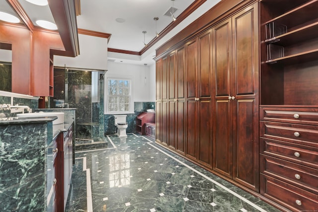 full bathroom featuring vanity, visible vents, a stall shower, ornamental molding, and toilet